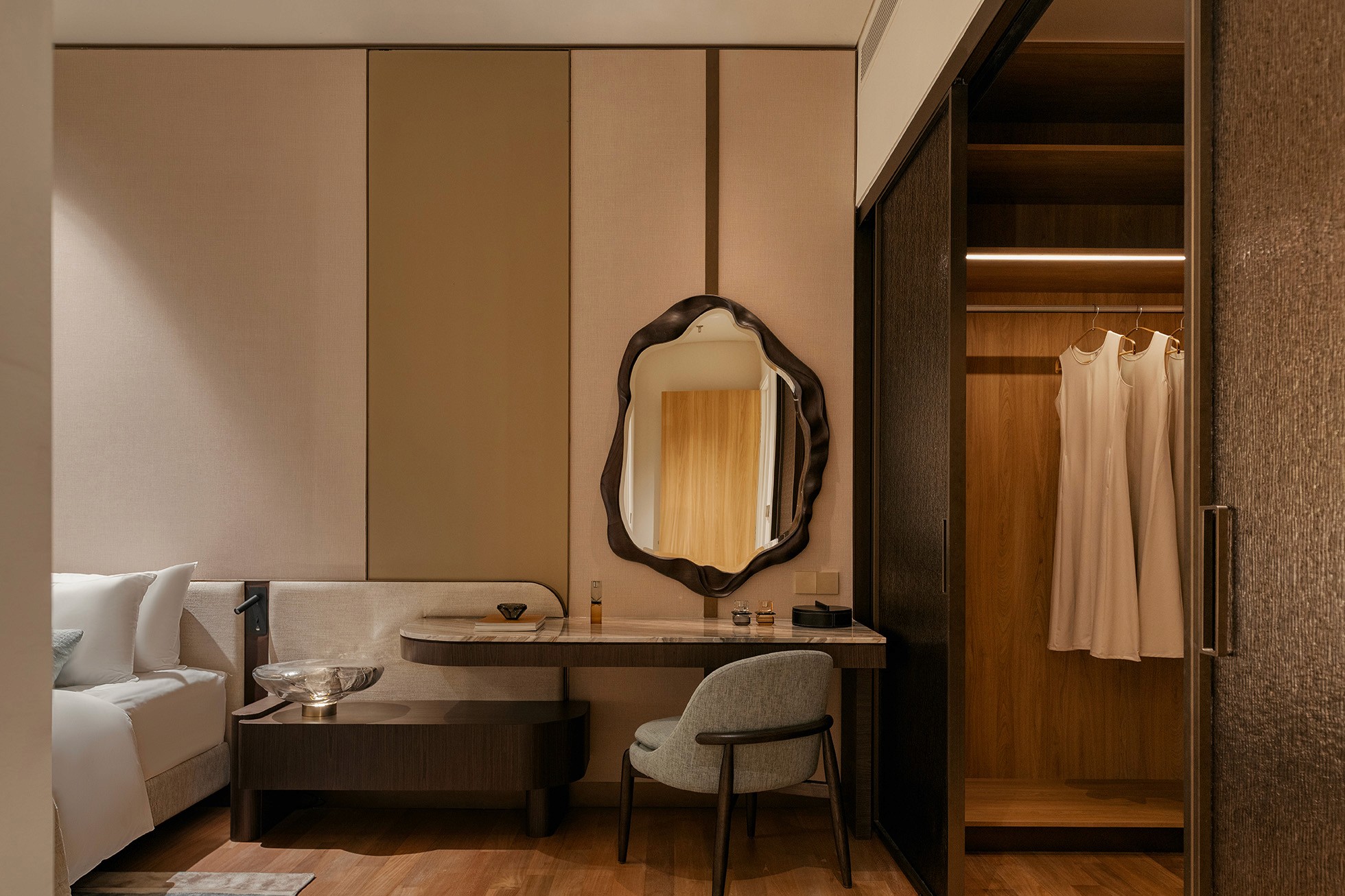 Dressing area with vanity, sculpted mirror and walk-in wardrobe — Gurney Drive Seafront Residences show unit