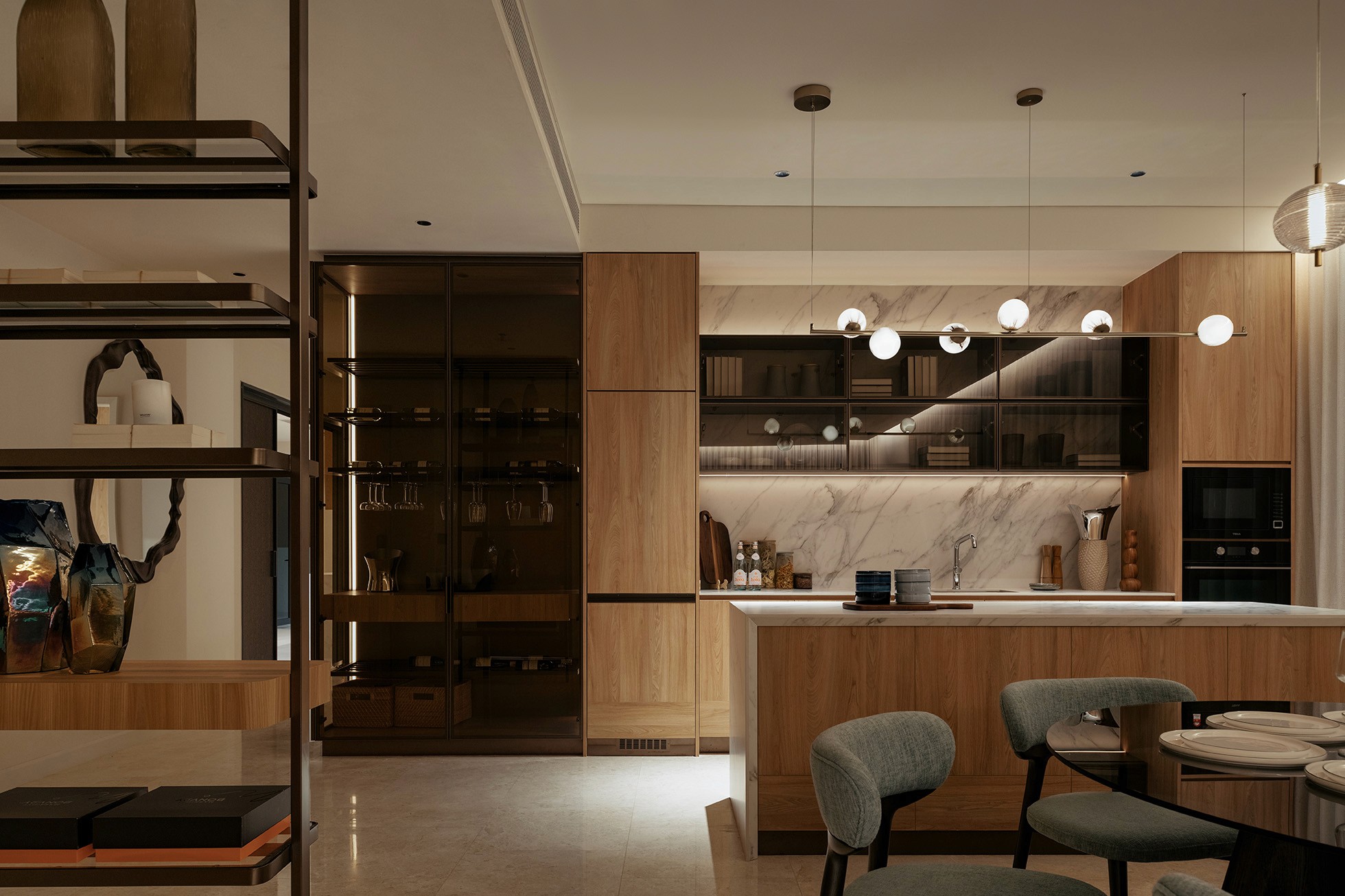 Dry kitchen and bar with glass display cabinetry and pendant lighting — Gurney Drive Seafront Residences show unit